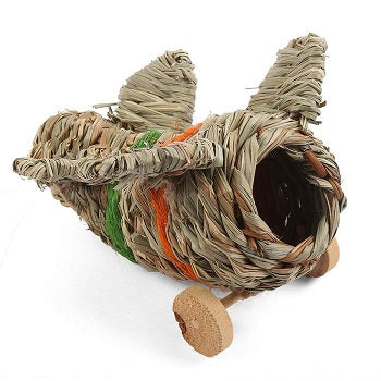 A toy aeroplane made out of woven straw with wooden wheels.