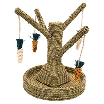 A tree-like structure made out of woven plant materials with 4 arms with woven carrots hanging from each.