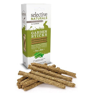 A pile of sticks of dried pea and mint in front of the product packet.