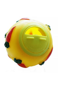 A spherical plastic yellow toy with embossed carrot designs on the exterior. It has a rotating access hole for inserting treats.
